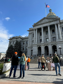 People standing in front of a government building