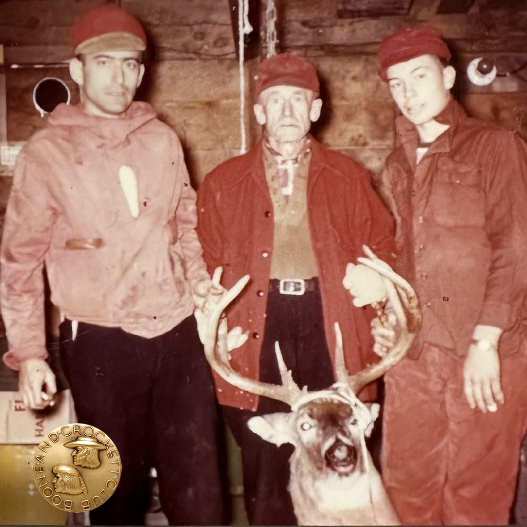 three men with whitetail deer
