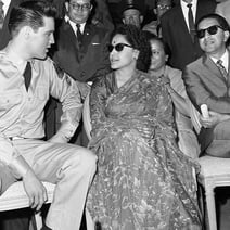 The king of rock & roll meets with King Mahendra (far right) and Queen Ratna while on the set of "G.I. Blues."