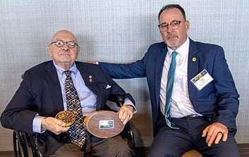 Honorary Life Member, and President Emeritus Lowell Baier (left) with the George Bird Grinnell Memorial Award for Distinguished Service to Natural Resources Conservation.