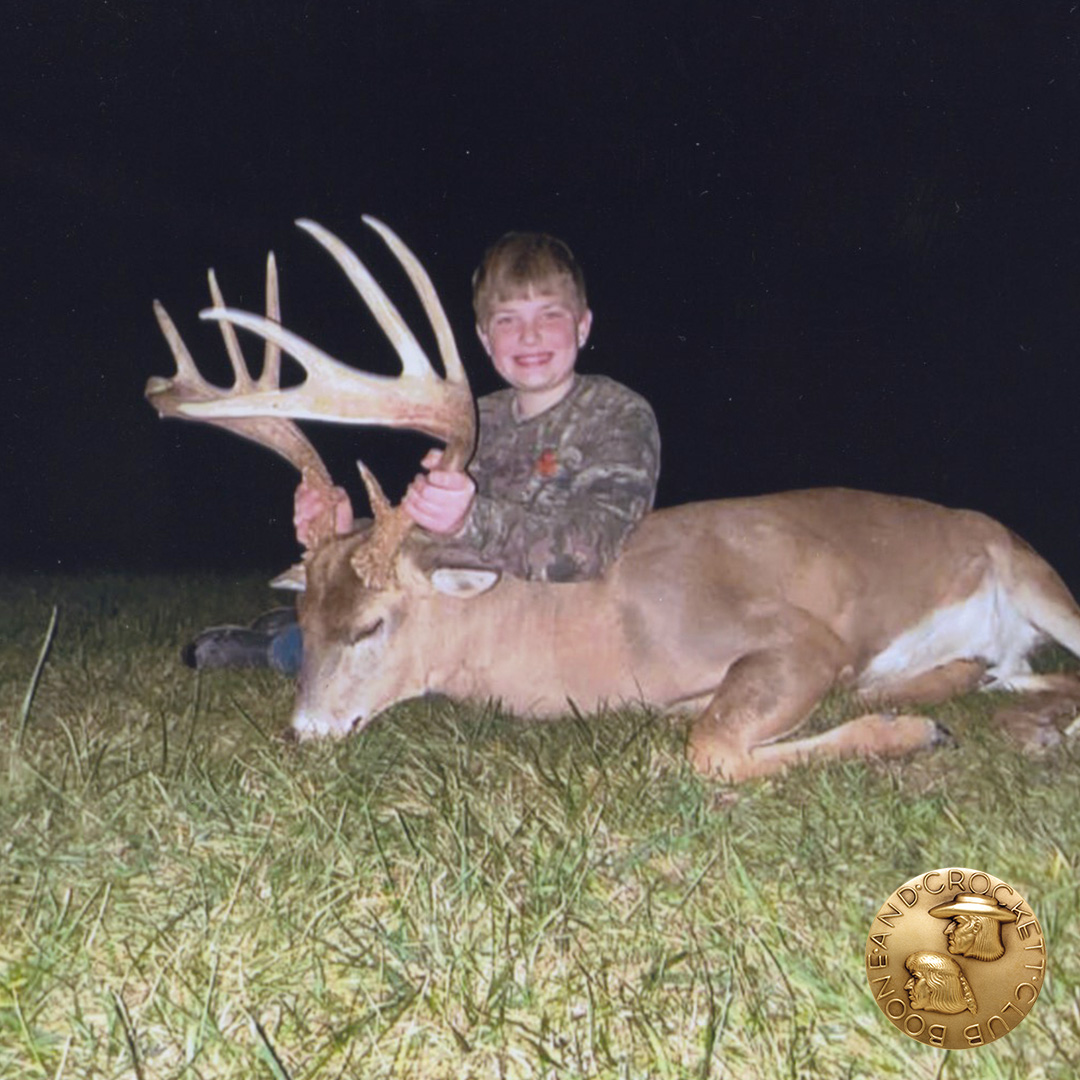 boy with whitetail deer