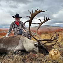 man with caribou