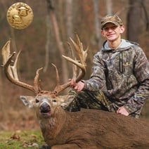 boy with whitetail deer