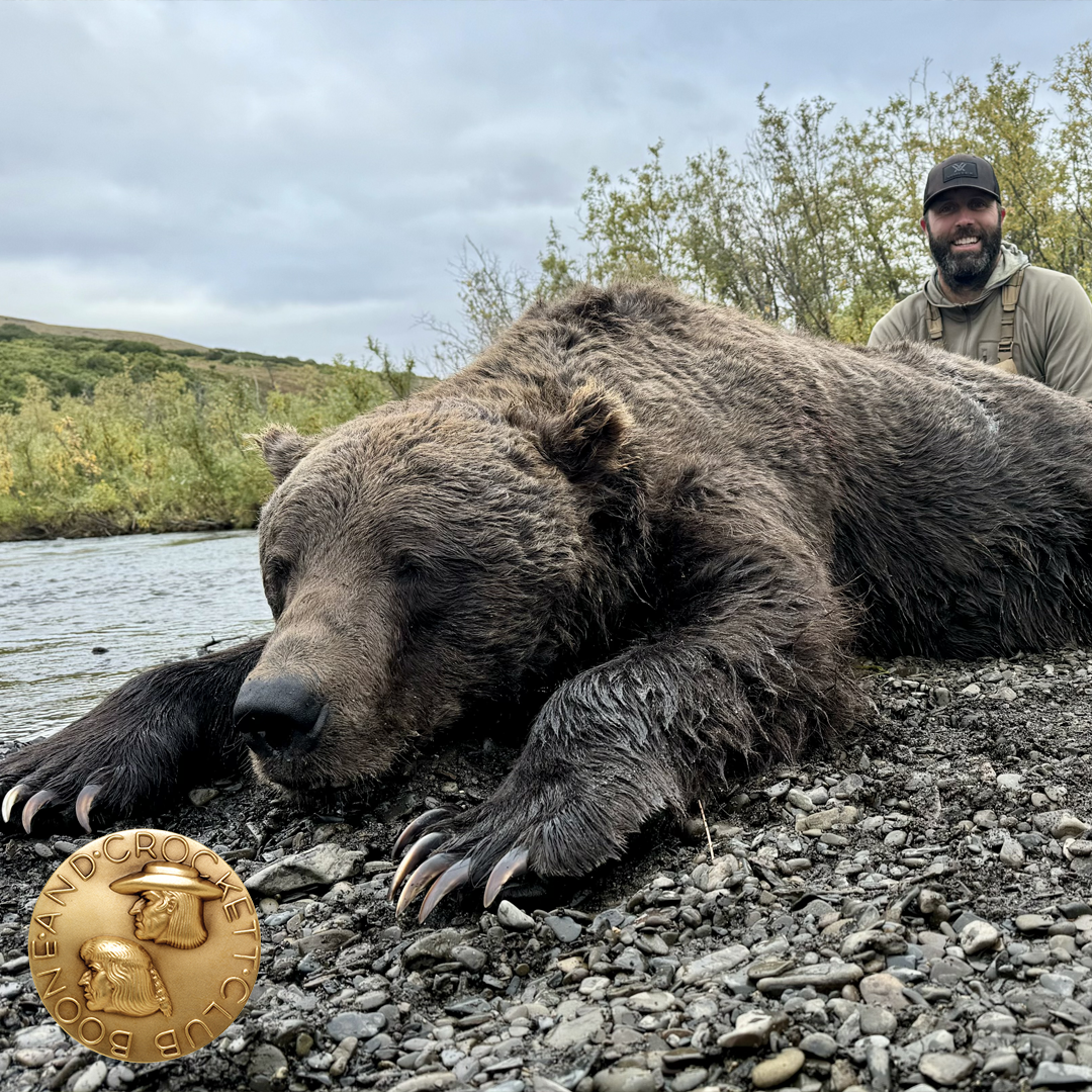 man with grizzly bear