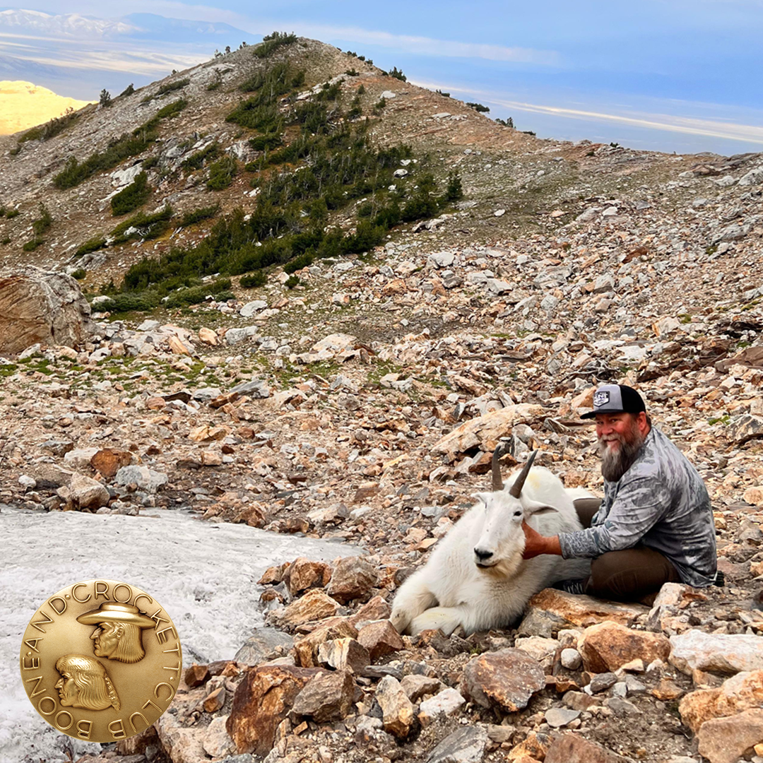 man with mountain goat