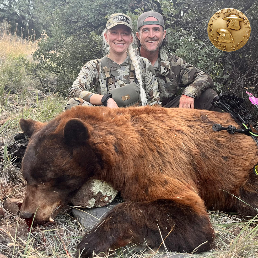 couple with black bear
