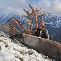 man with caribou