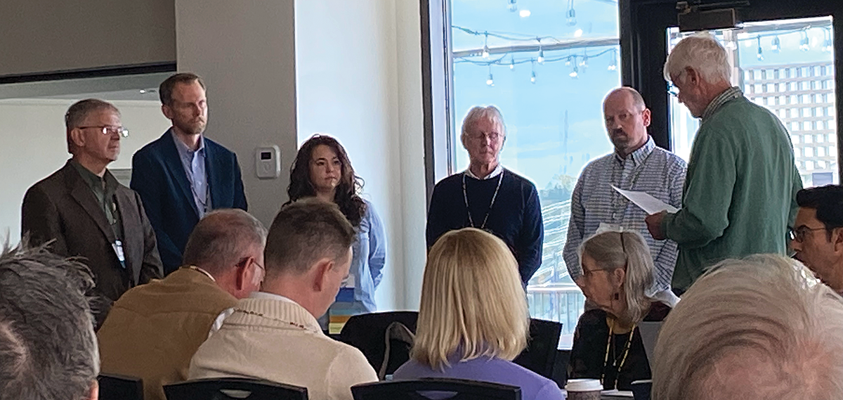 Professional Member Chad Bishop (second from left) and University of Wisconsin Stevens Point Professor Jason Riddle (second from right) were sworn in as Representatives to TWS Council.