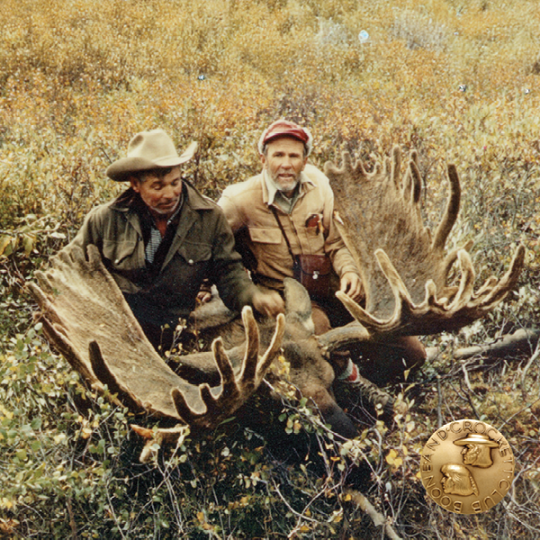 vintage photo of two men with a moose