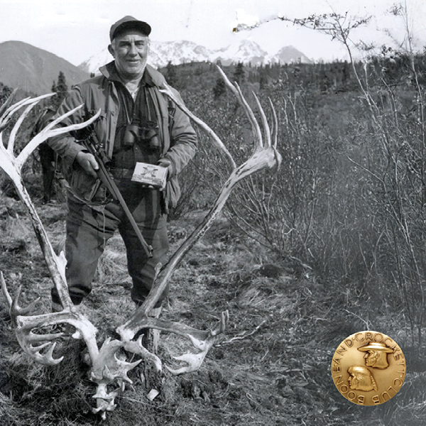 vintage photo of a man with a caribou