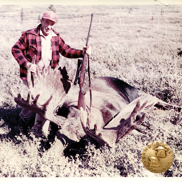 vintage photo of a man with a moose