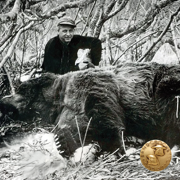 vintage photo of a man with a grizzly bear