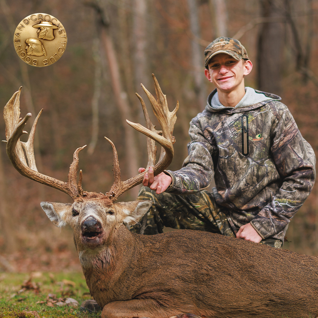 boy with whitetail deer