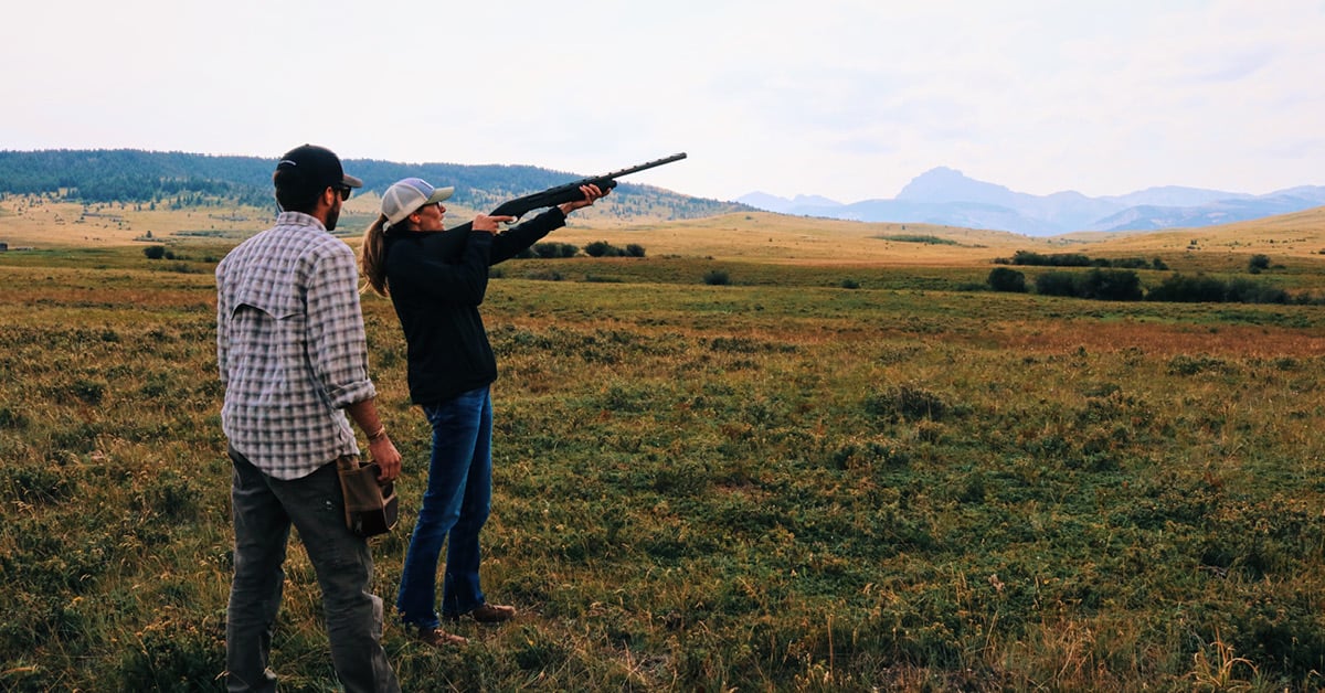 woman shooting shotgun