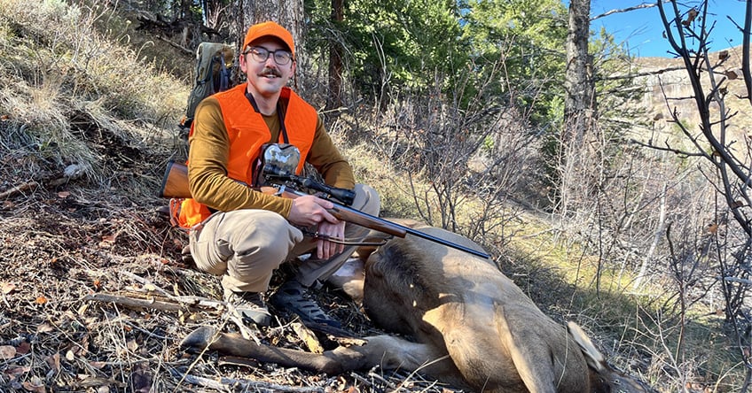 Zack Nowak with a harvested cow elk