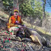 Zack Nowak with a harvested cow elk