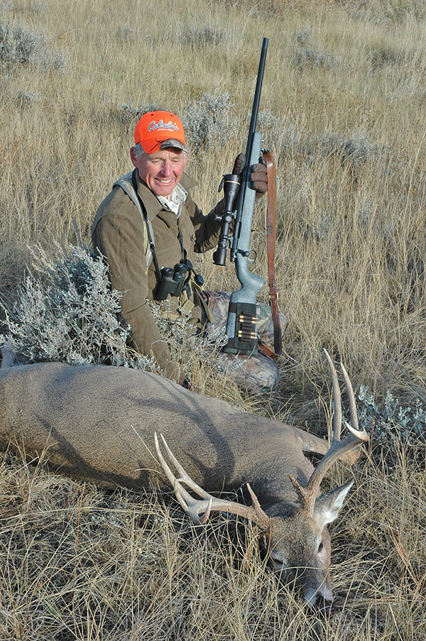 hunter with whitetail deer