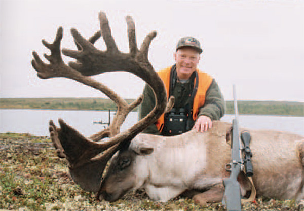 hunter with caribou