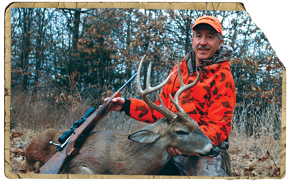 hunter with whitetail deer