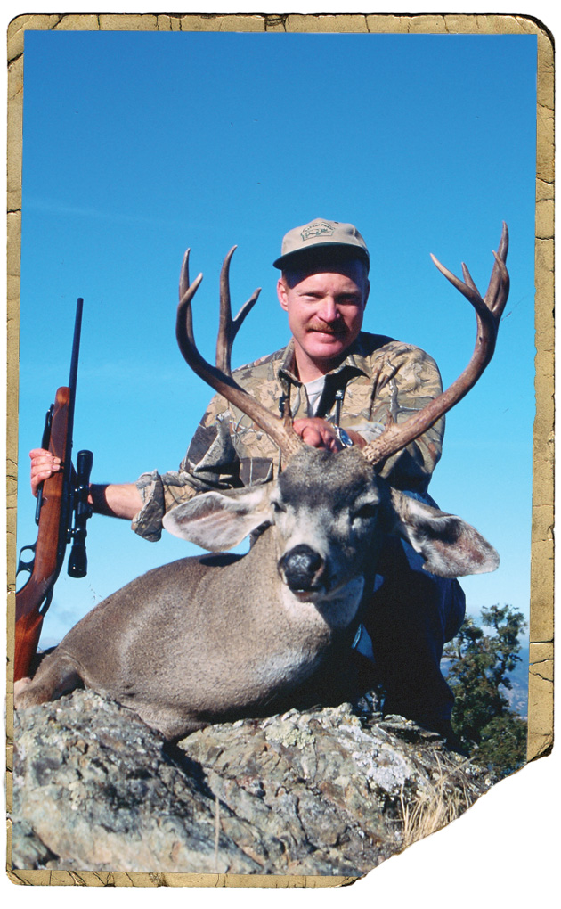 hunter with mule deer