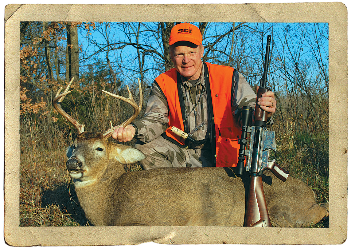 hunter with whitetail deer