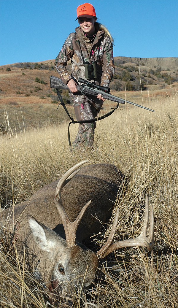 hunter with whitetail deer