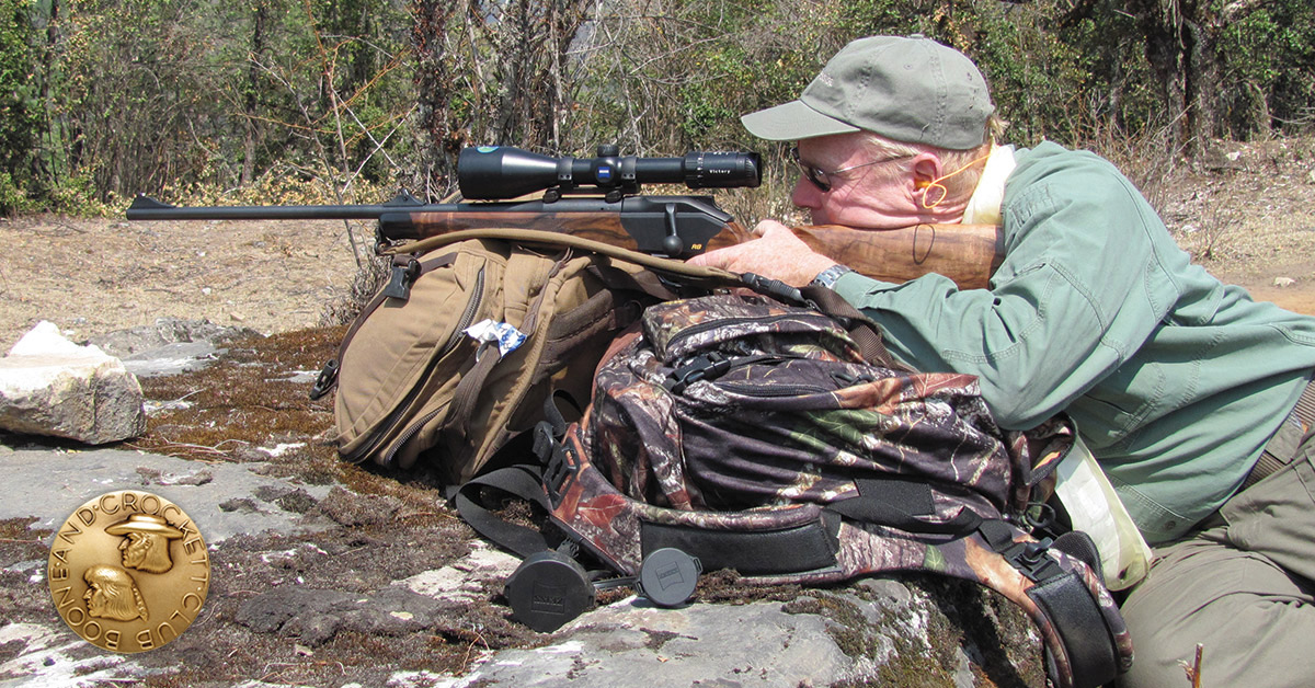 hunter shooting rifle