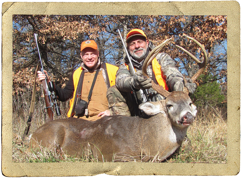 hunter with whitetail deer