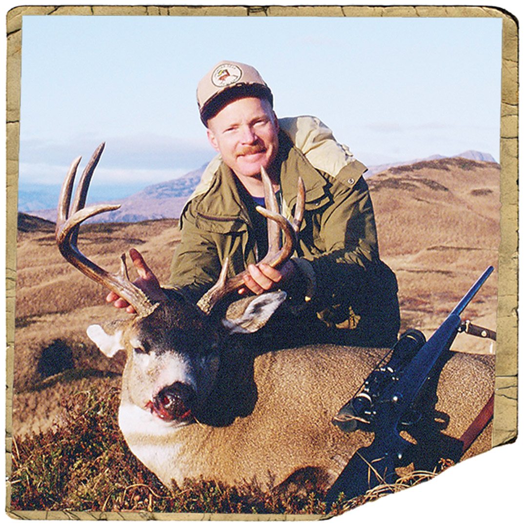 hunter with whitetail deer