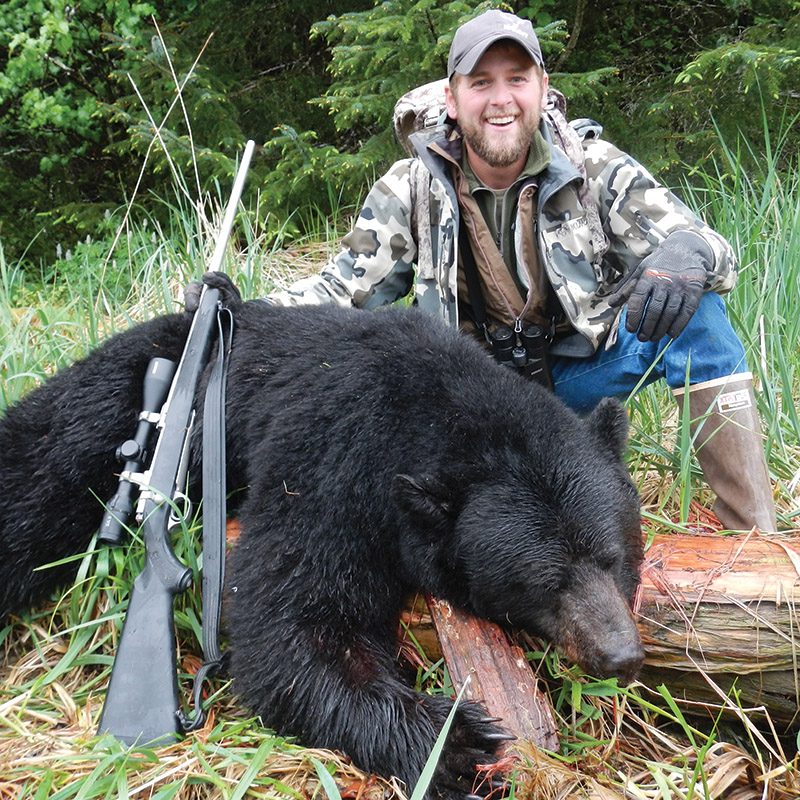 hunter with black bear