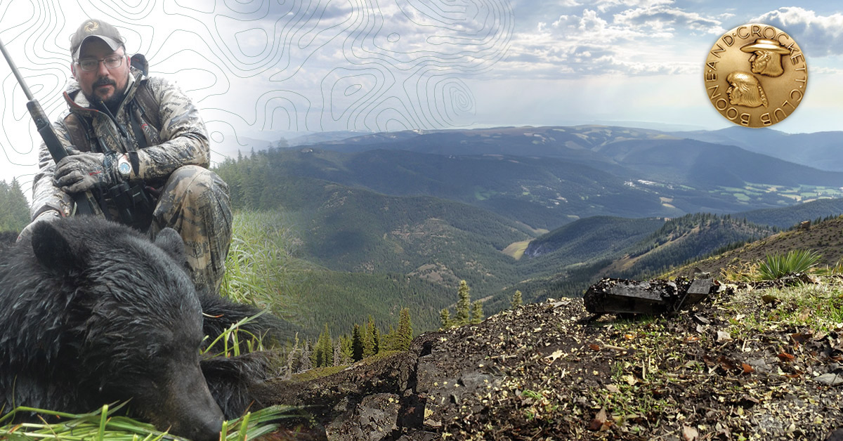 hunter with black bear