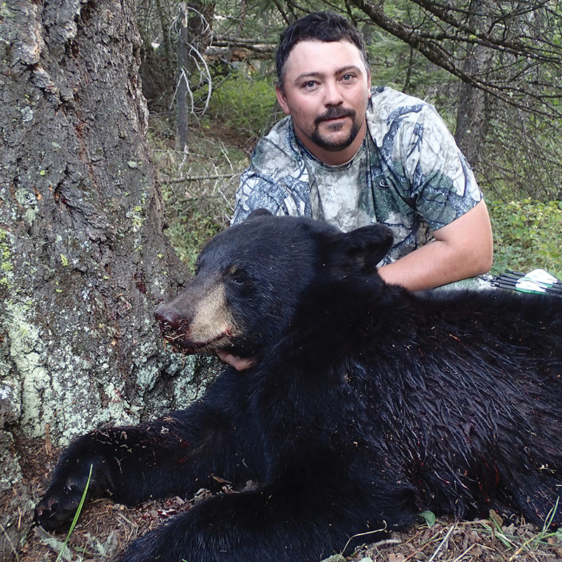 hunter with black bear