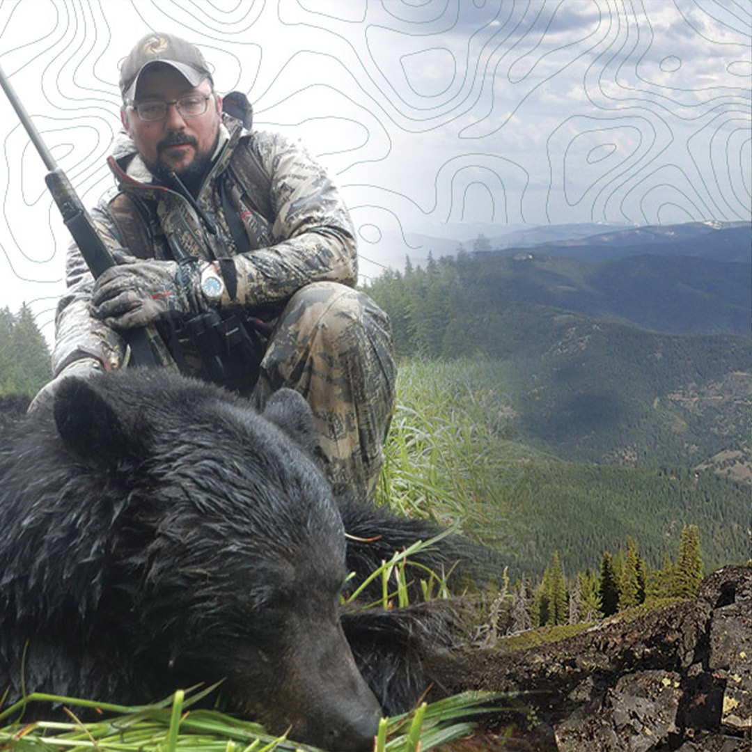 hunter with black bear