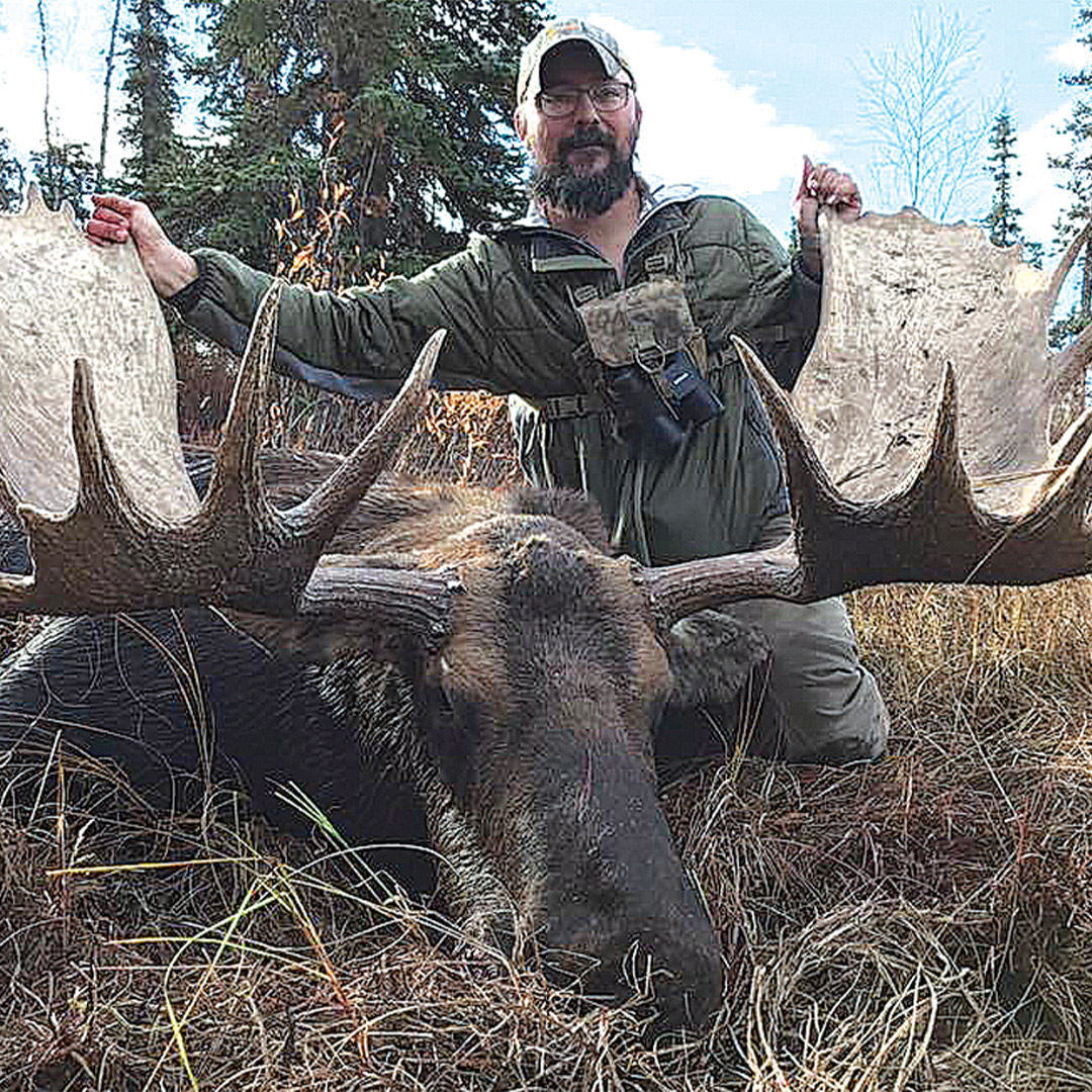 hunter with moose