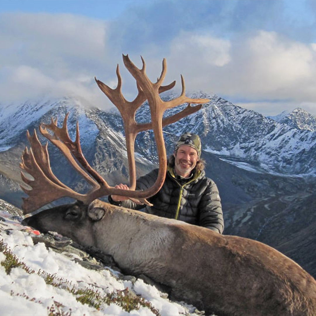 man with caribou