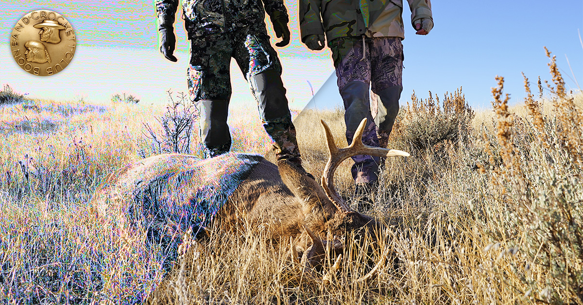 hunters walking up on deer
