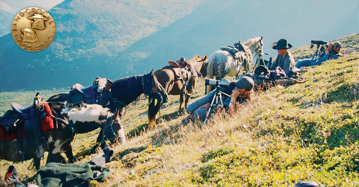 guys shooting photography on side on mountain