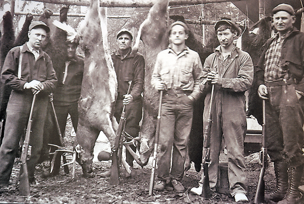 group of men with deer