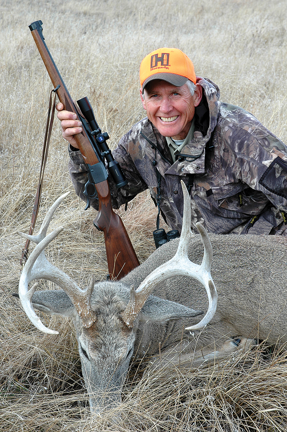 hunter with whitetail deer