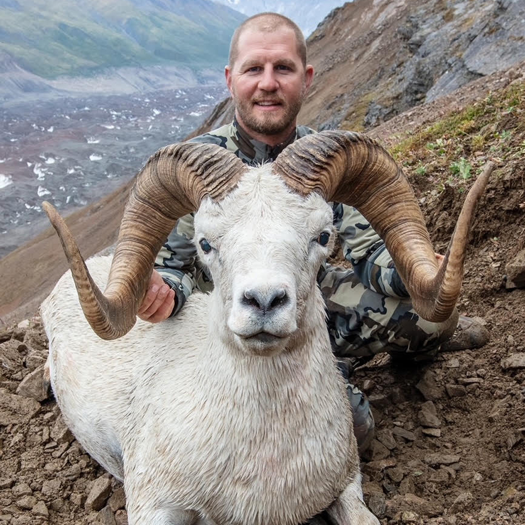 hunter with dall's sheep
