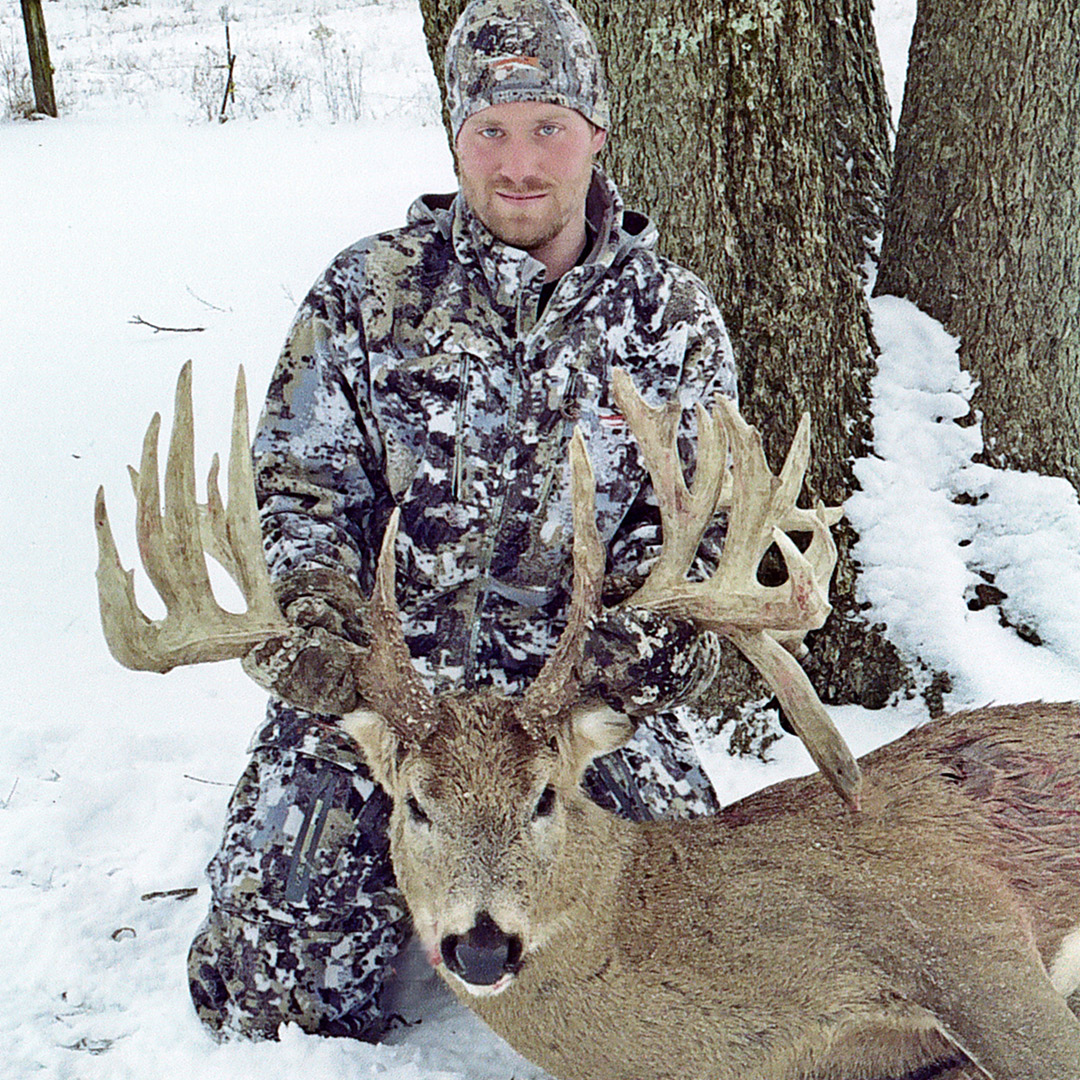 hunter with whitetail deer