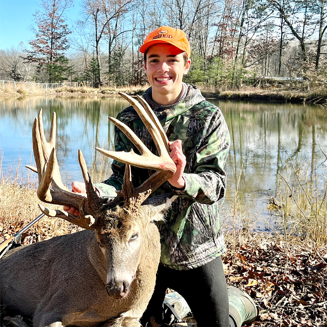youth hunter with whitetail deer harvest