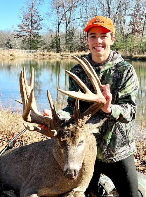 youth hunter with whitetail deer harvest