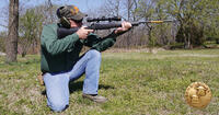 man shooting rifle