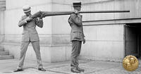 two men holding giant rifle